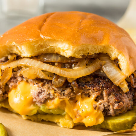Image of Savory Cheddar Stuffed Burger with Caramelized Onions Recipe